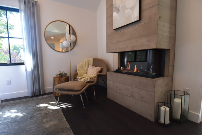 3 sided gas fireplace in a modern showhome