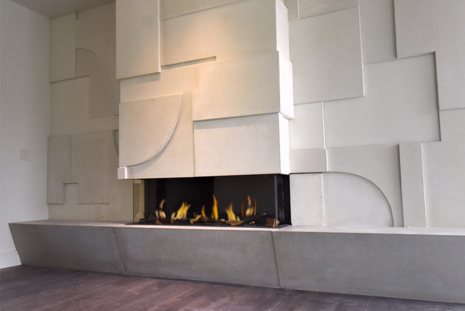 3sided fireplace with textured surround. Clean and modern fireplace with unique surround.