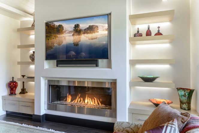 flatscreen tv above a modern gas fireplace by Element4