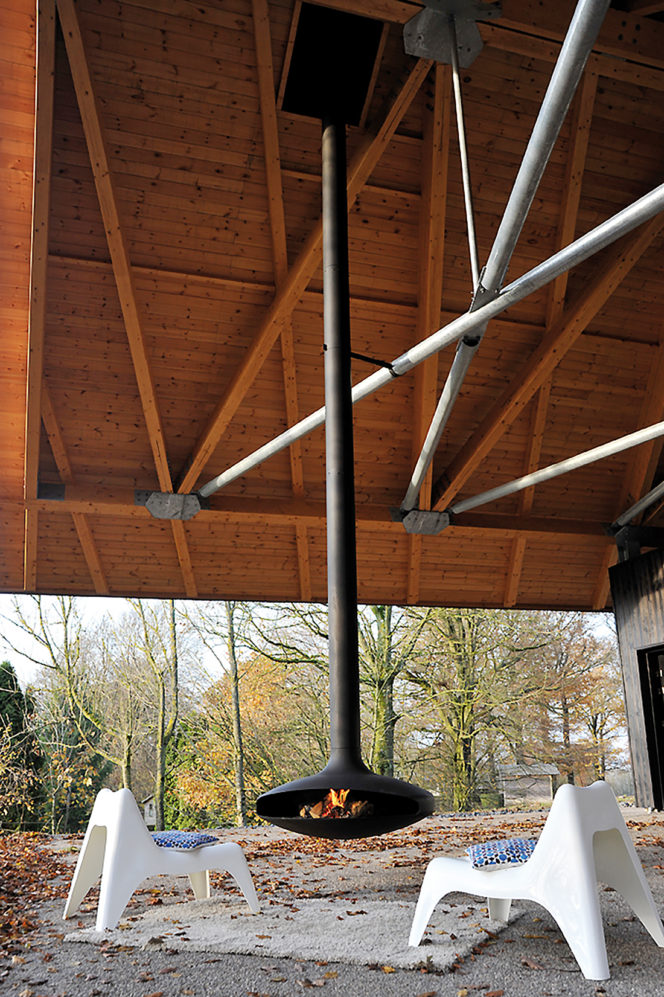 Floating outdoor fireplace with modern design features.