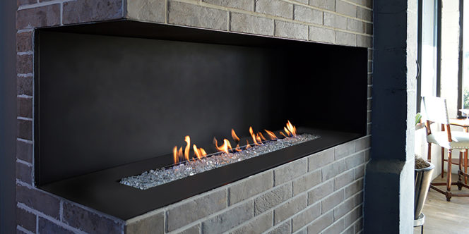 H Series corner style vent free fireplace with glass fire media and matte black interior