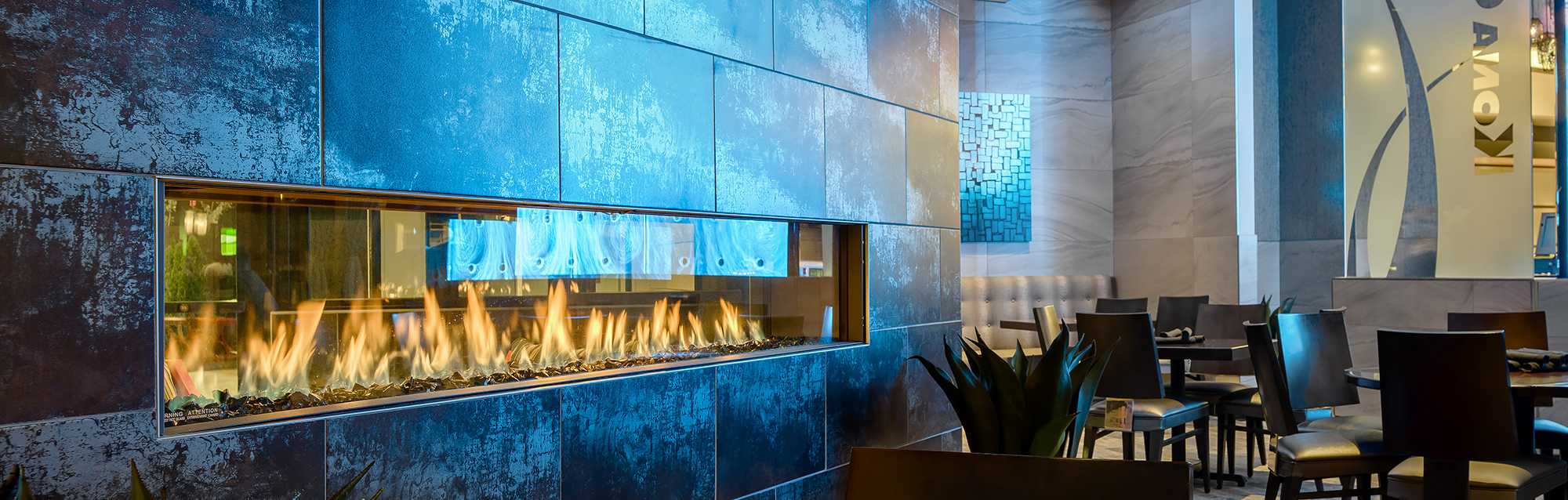 8' Wide see-throgh modern fireplace perfect for commercial projects.