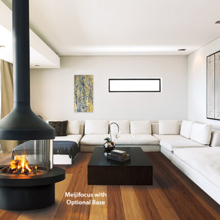 Round glass and steel fireplace in a modern living room.