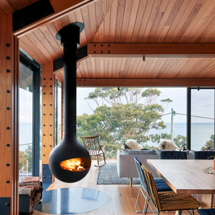 Round rotating fireplace in a modern Cabin by Focus Fires