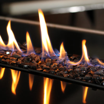close up of h series vent free fireplace and black stone fire media
