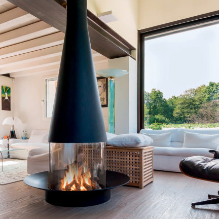 Round modern fireplace with 360 degree views of the fire. Available in gas and wood.