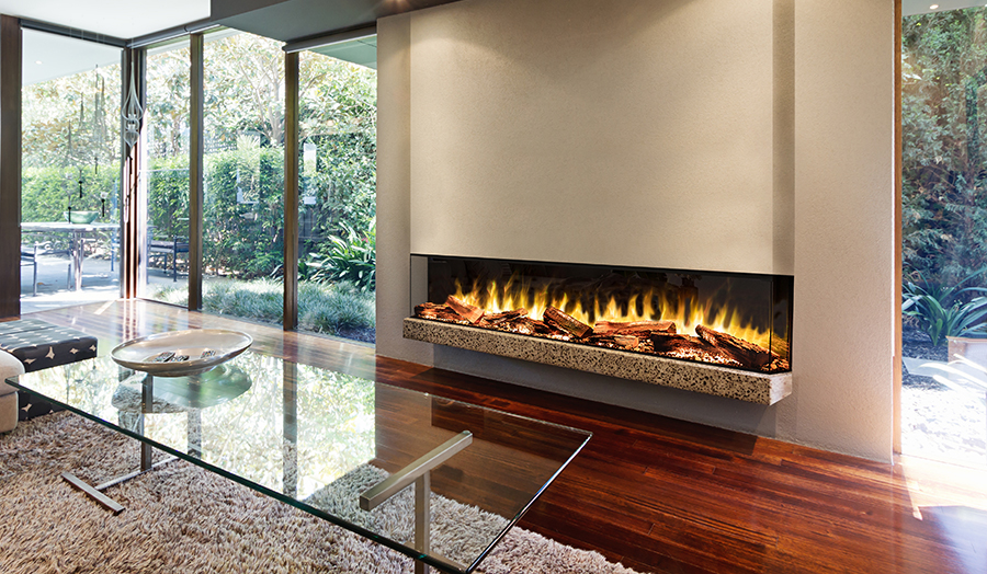 Blazing fire in living room of luxury architect designed house